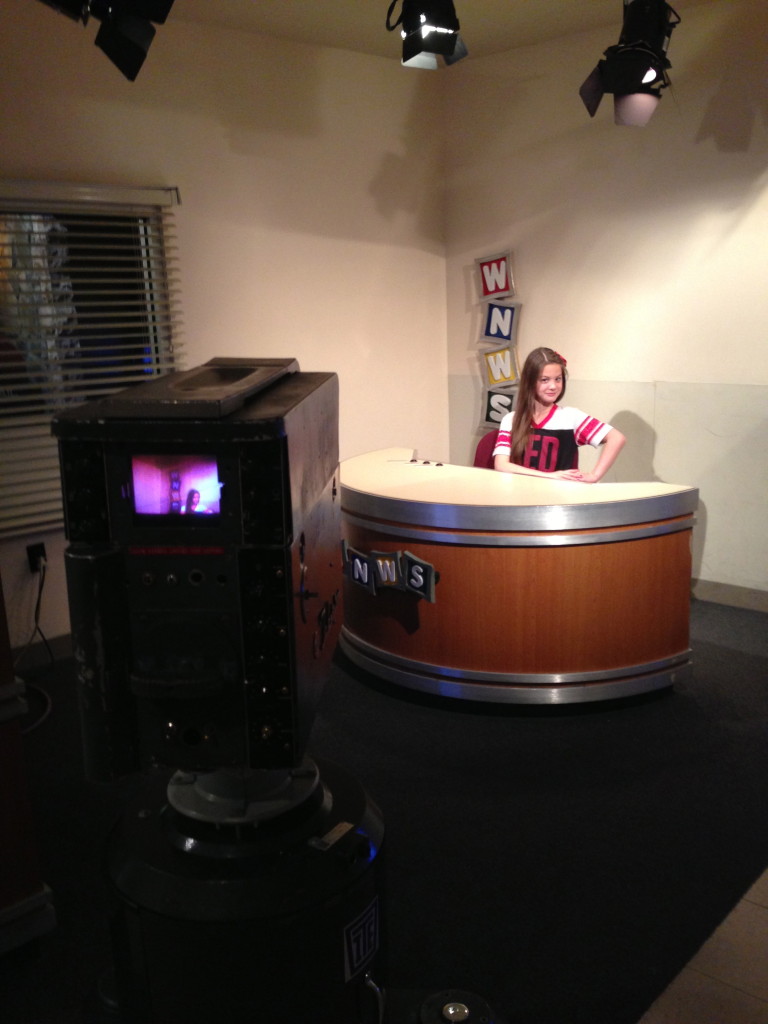 Maya as a Television Reporter at Progress COSI